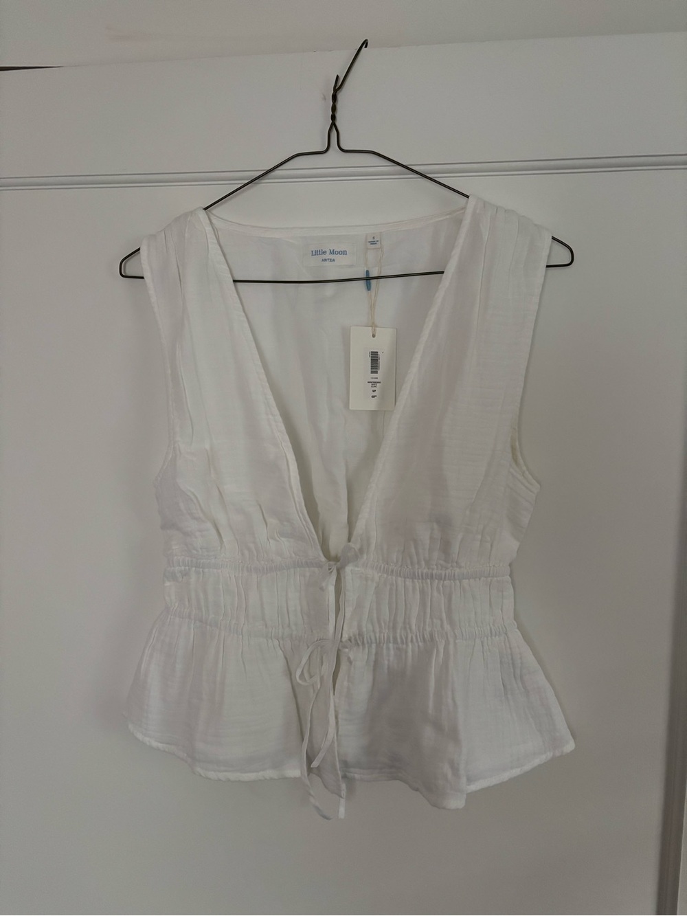 Aritzia White Sleeveless V-Neck Drawstring Peplum Camisole